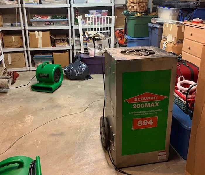 Basement with SERVPRO air movers and dehumidifiers