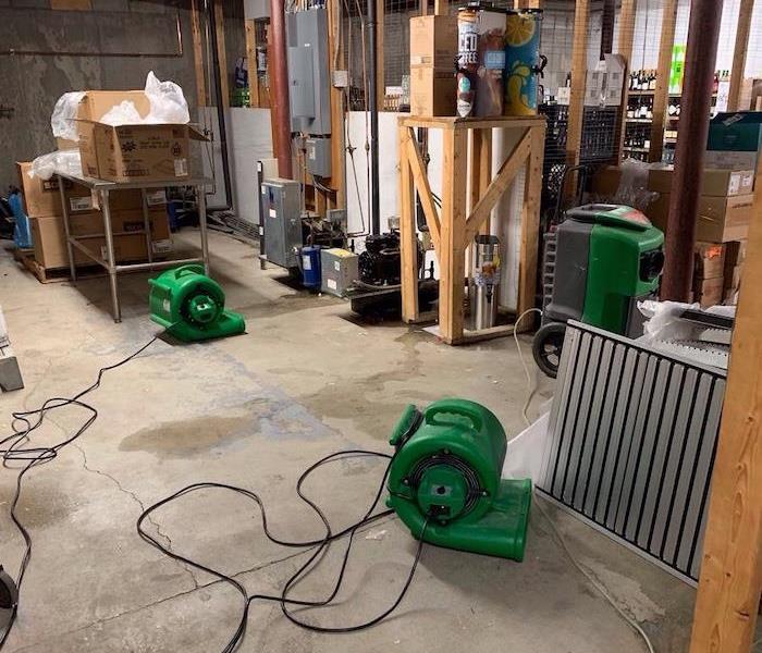 basement with drying equipment active