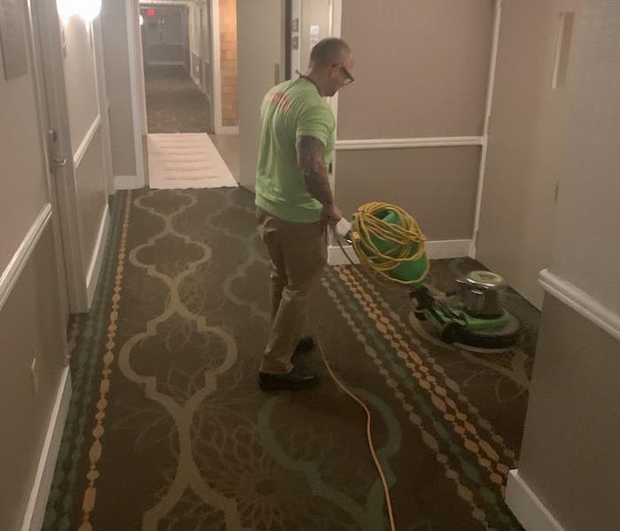 SERVPRO tech with cleaning equipment