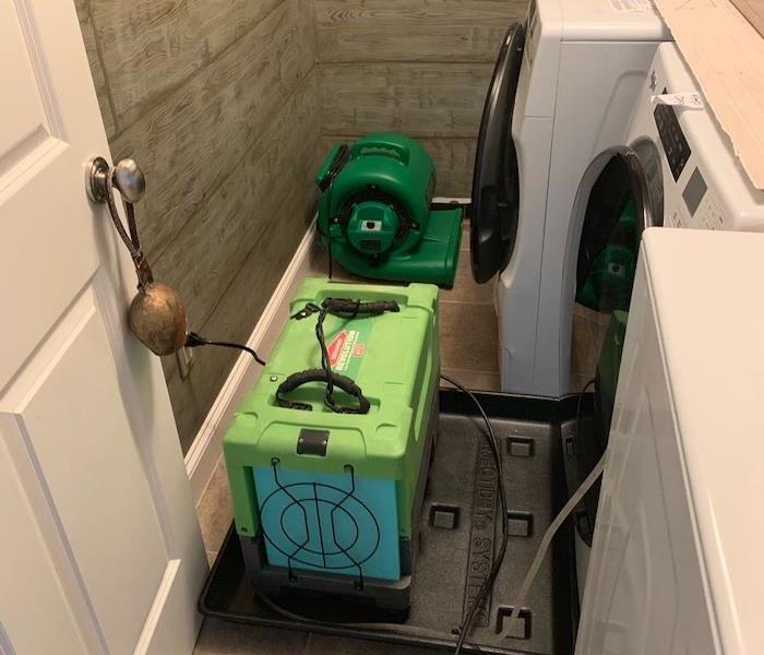 Laundry room with drying equipment