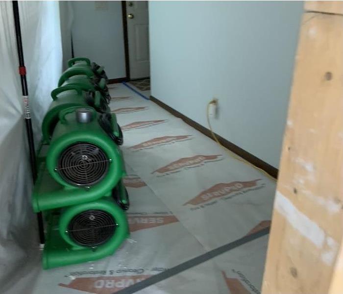 air movers stacked in a water damaged home